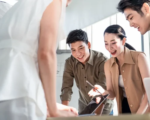 Group of Asian business people brainstorm solve problem and present new idea. Woman discuss in teamwork on new challenge topic in meeting room. Business finance and communication planning concept.
